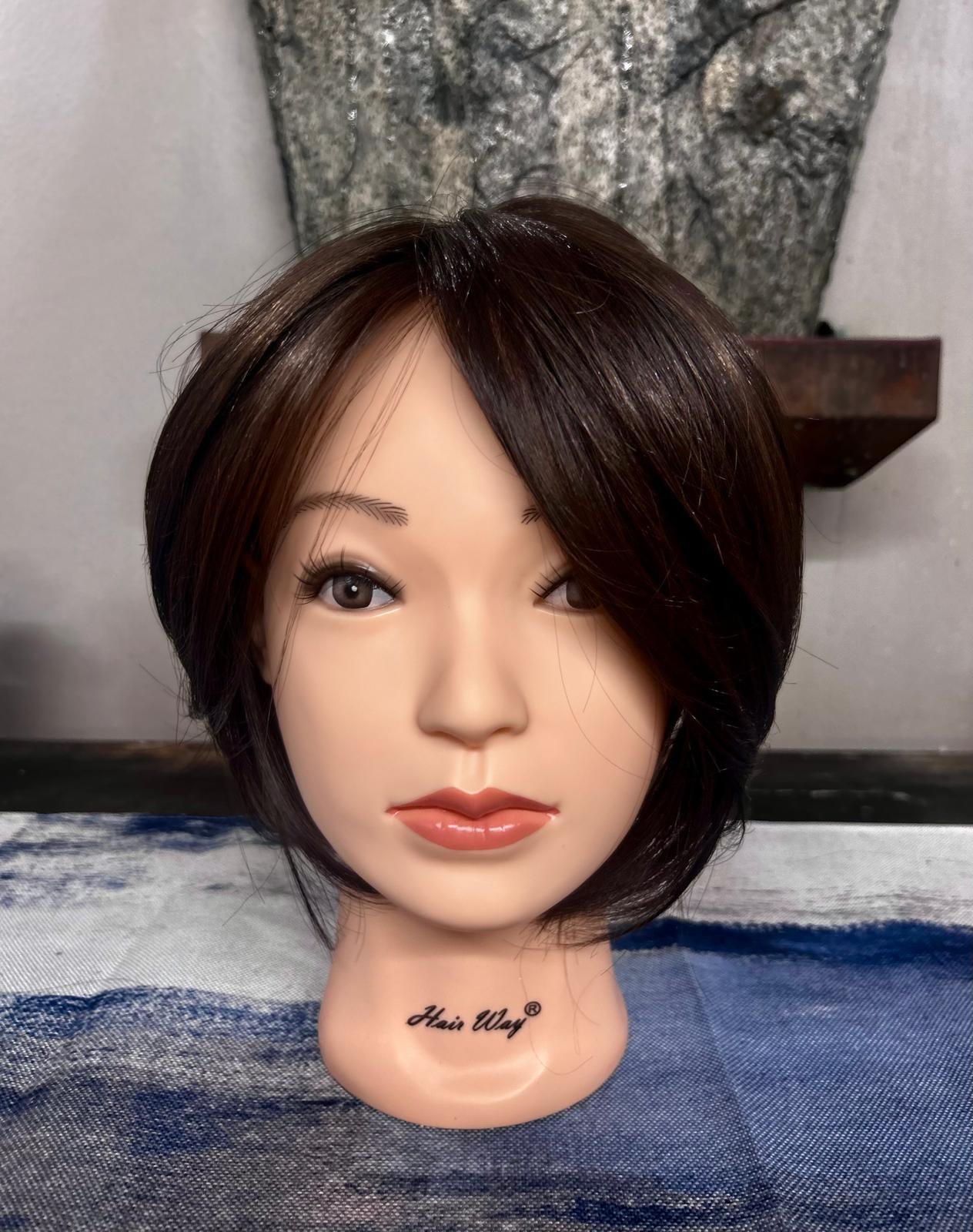 Dark brunette topper with a sleek side-swept shape