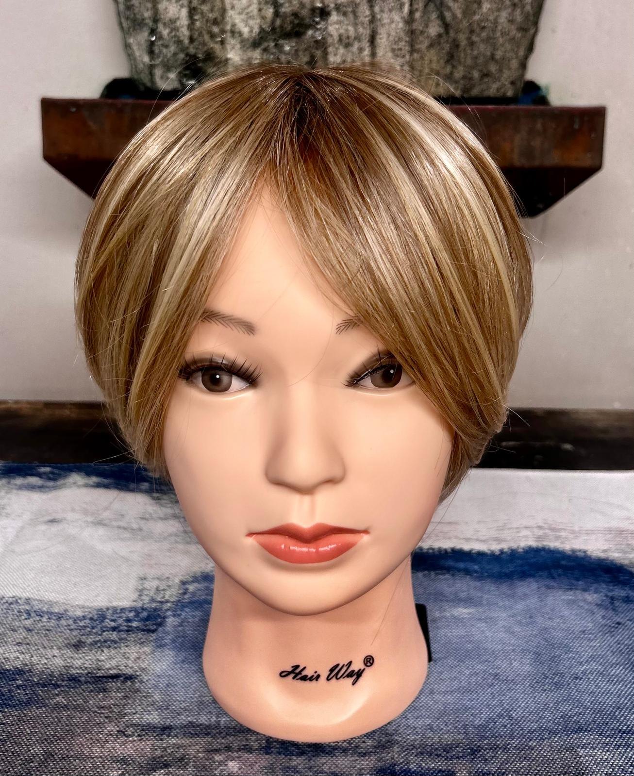 Short highlighted blonde and light brown topper with side-swept fringe