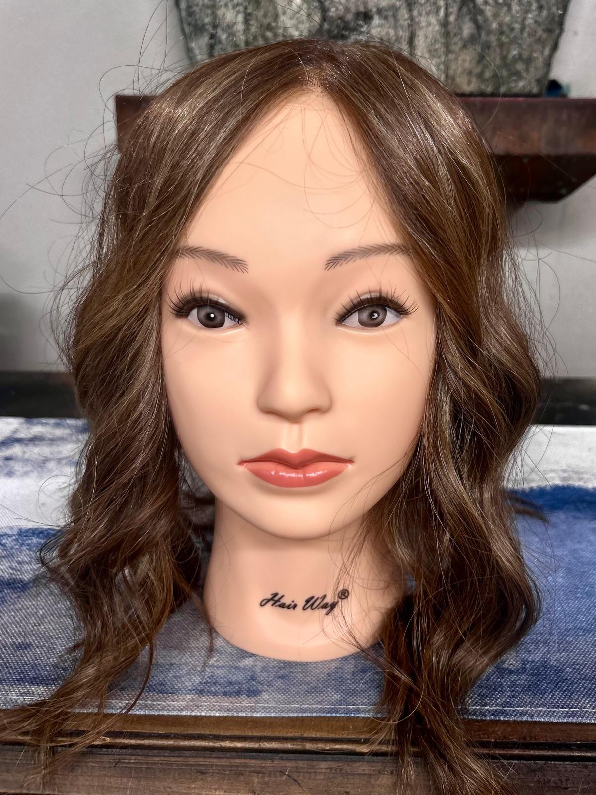 Long softly waved bronde topper with a natural center part